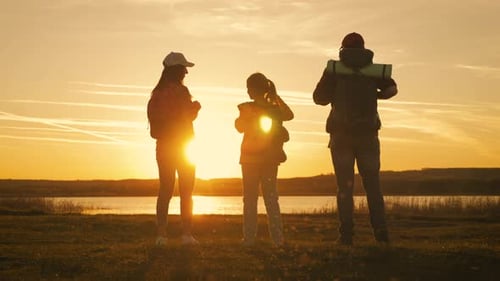 Silhouette of Family at the Coast