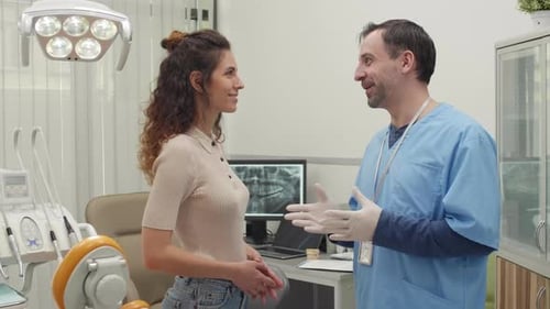 Portrait of Woman Talking to Dentist