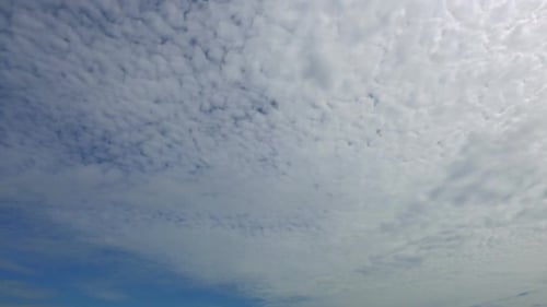 Time lapse of white cloud moving pass around sky background