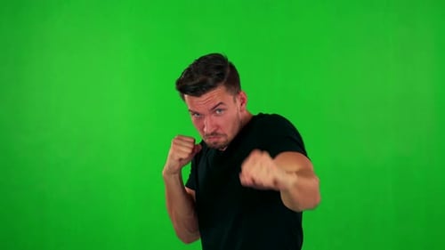 Young Handsome Caucasian Man Does Box - Green Screen - Studio