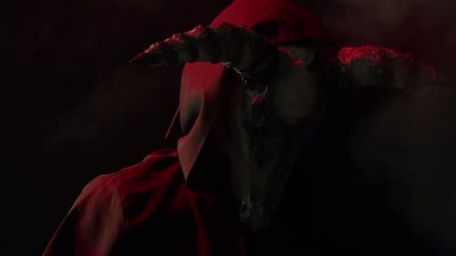 Demonic Entity with Horns in Dark, Foggy Setting