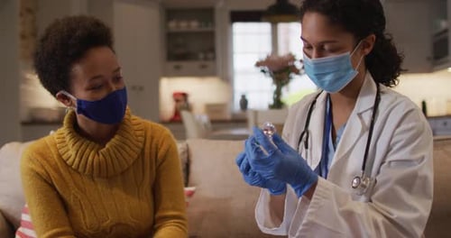 Healthcare Worker Administering Vaccine in Patient's Home