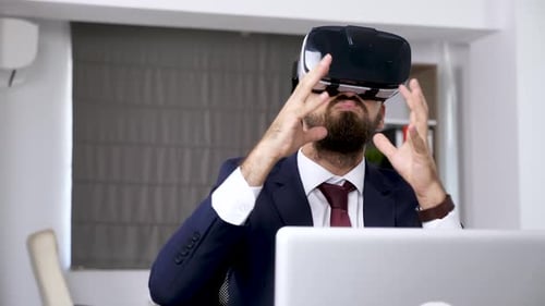 Man Uses VR Headset in Office Setting