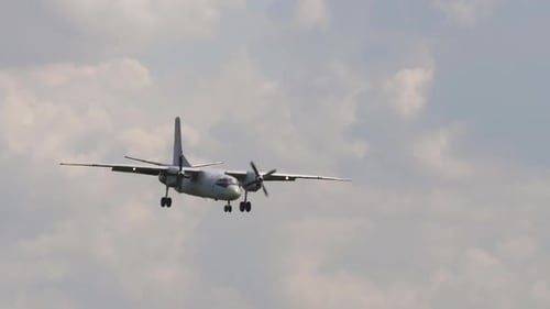 Cargo Airplane Flying in Cloudy Sky