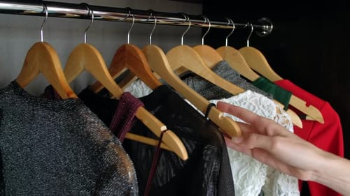 Choosing Black Clothes From Wardrobe