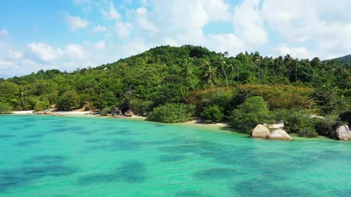 Aerial drone shot landscape of marine coast beach voyage by blue green water with white sandy backgr