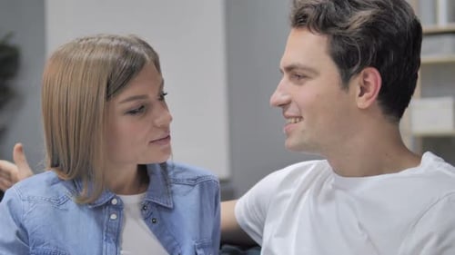 Close Up of Talking Young Couple Discussing and Sharing Information