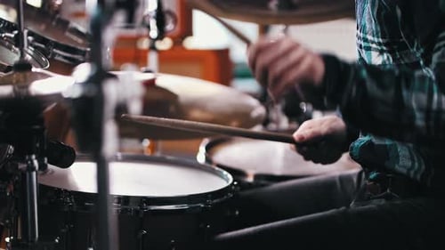 Drummer Plays a Drum Set Close Up
