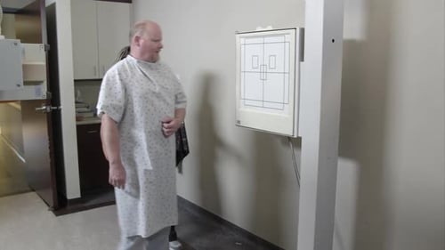 Man Getting Ready for an X-Ray in Hospital