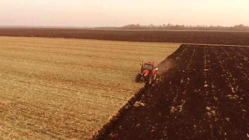 Tractor Plowing Big Farm Field
