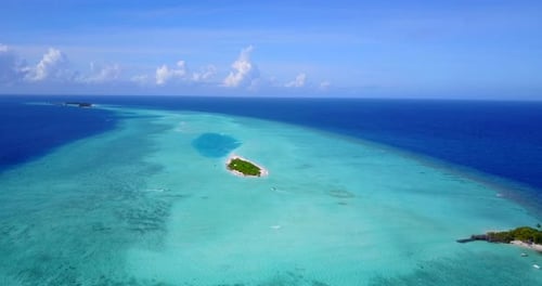 Large turquoise lagoon of Ari atoll around tiny tropical islands in the middle of blue endless ocean