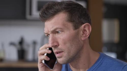 Angry Man Shouting at Smartphone