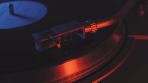 Vinyl Record Player Spinning Close Up in Moody Lighting