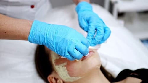 Woman Receiving a Facial at a Clinic