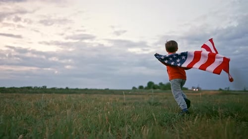 Child Runs with American Flag in Field