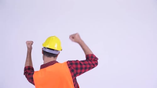 Rear View of Happy Bearded Persian Man Construction Worker with Fists Raised