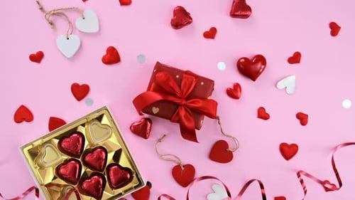 Heart Decorations and Gift on Pink Background