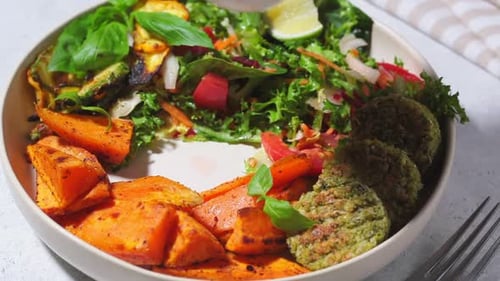 Pouring Salad Dressing on Healthy Bowl of Food