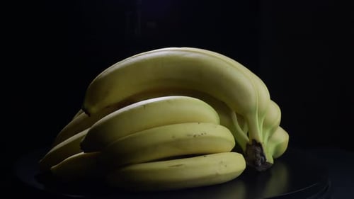 Rotating Bunch of Fresh Yellow Bananas
