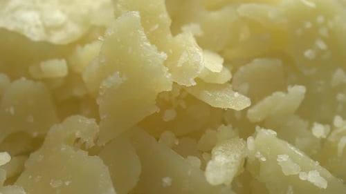 Fond de fromage parmesan en morceaux de rotation