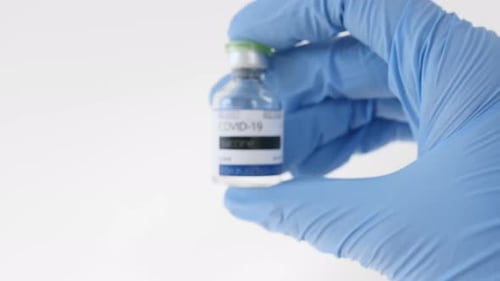 Close Up Of A Hand Holding COVID-19 Vaccine