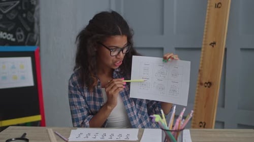 Enthusiastic Teacher Explains Geometry Lesson At Desk