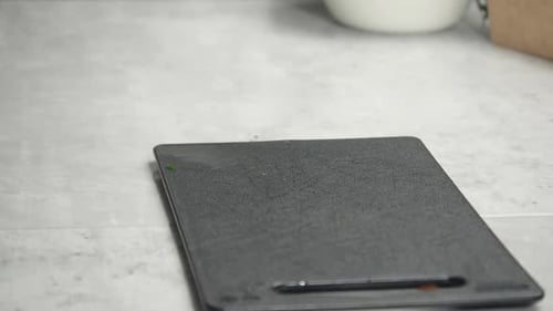 Narrow focus close up: Knife is placed on small kitchen cutting board