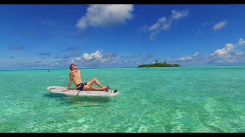 Romantic couple tan on beautiful sea view beach time by blue water with white sand background of the