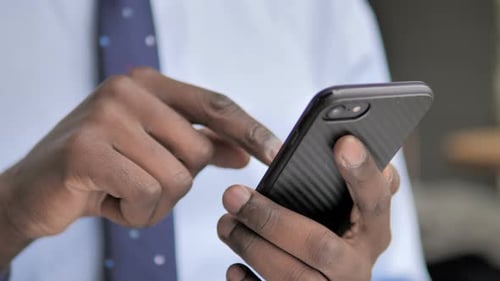 Hands Using Mobile Phone in Office Setting