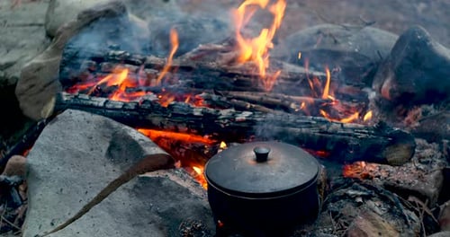 Bowler Hat Near the Fire in the Forest