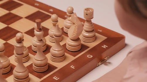 Kid Makes First Move in Chess