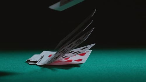 Cards Falling in Slow Motion on Green Felt