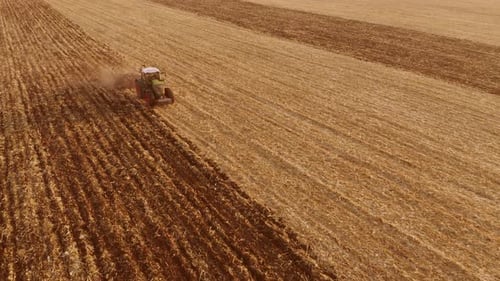 Tractor Working on the Field Top View
