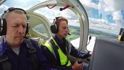 Flight Instructor Mentoring Student on Practice in Air