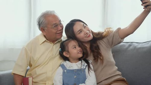 Happy Family Taking a Smartphone Selfie