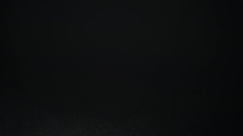 Abstract Water Particles on Black Background