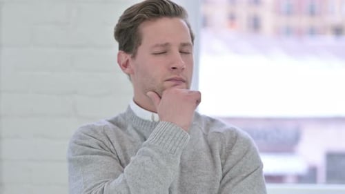 Portrait of Thoughtful Creative Young Man Thinking