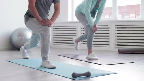 Two Sporty People Exercising Together