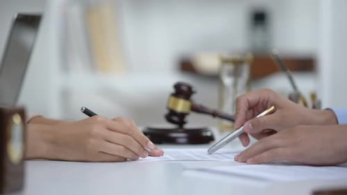 Lawyer Showing Woman Where to Sign Court Claim, Professional Help to Plaintiff