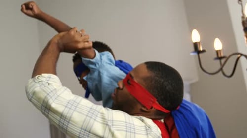 Father and Son Playing Superheroes Together