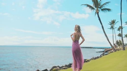 Woman in Pink Dress on Tropical Beach