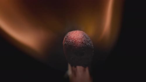 Igniting Matchstick Head Burns in Extreme Close Up