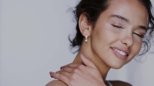 Pretty Woman Posing with Curly Brown Hair
