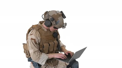 Soldier Typing on Laptop in Military Gear