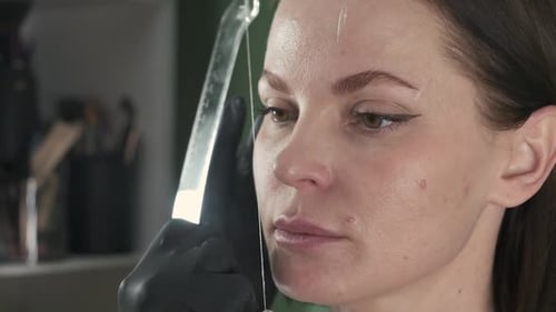Eyebrow Shaping Treatment with String in Beauty Salon