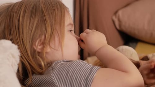 Toddler Lying in Bed, Close Up