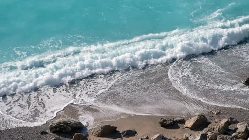 Turquoise Ocean Waves Crashing on Beach Shore
