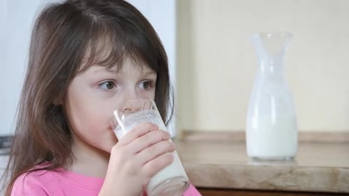 The child drinks milk.