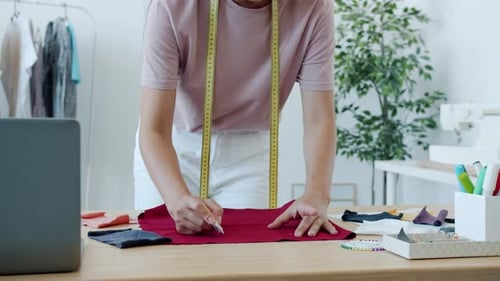 Designer Marking Fabric with Chalk in Bright Studio