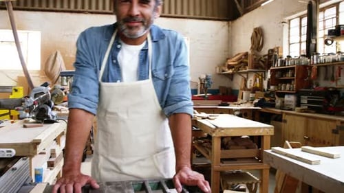 Carpenter smiling for camera